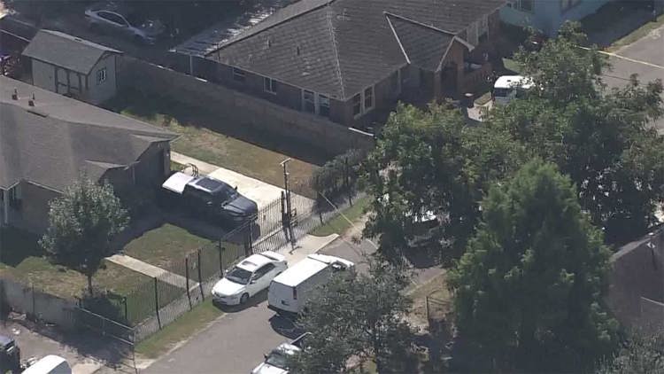 Baytown police car lights flashing on a residential street at dusk